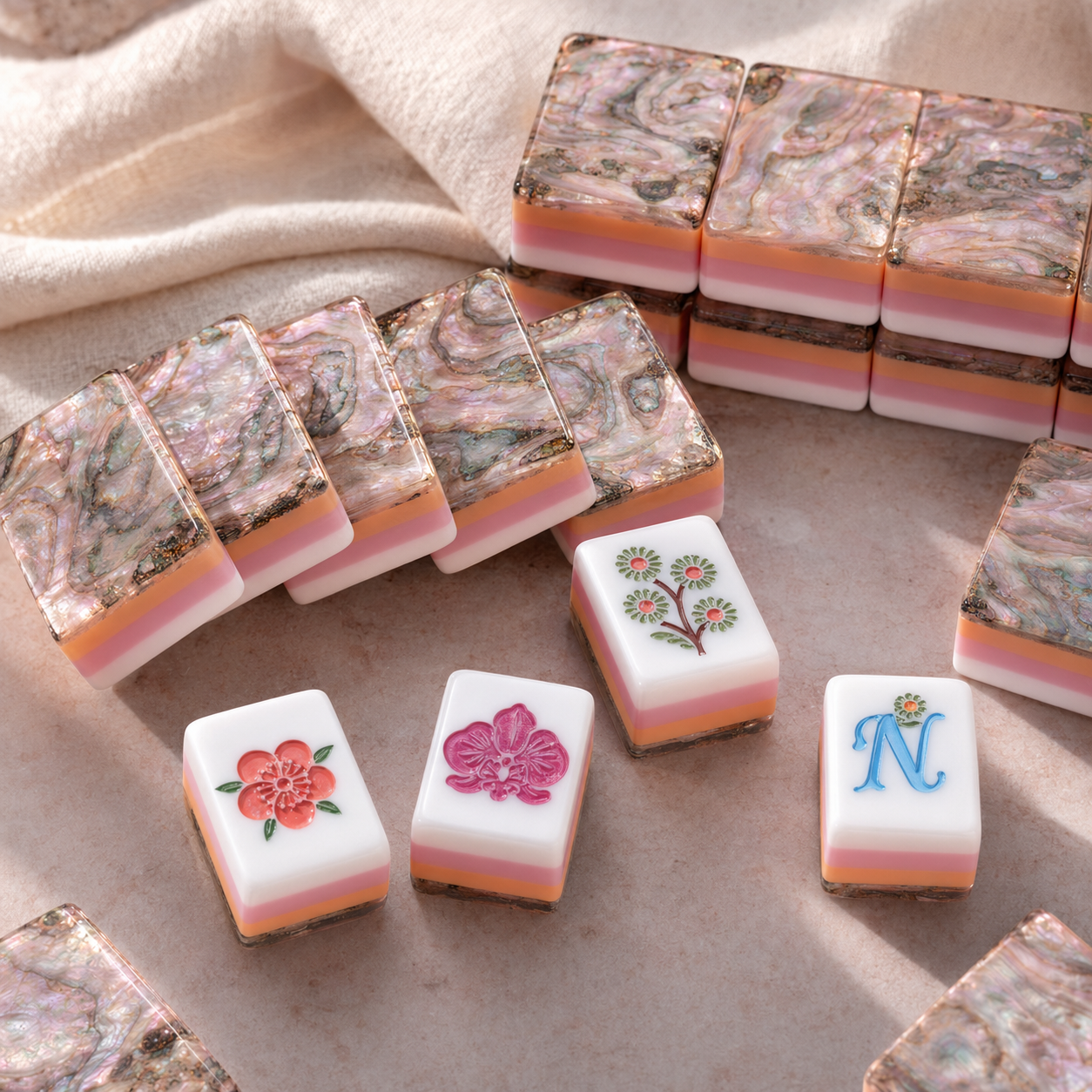 Iridescent abalone-inspired backs and blush layered Mahjong tiles