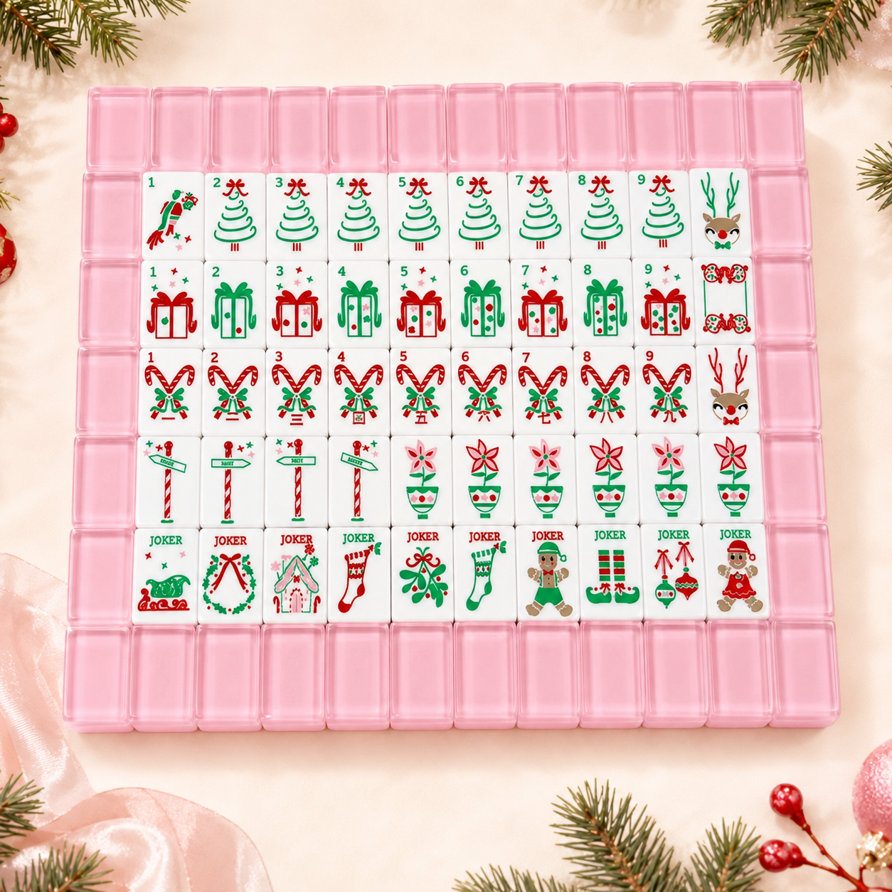 Complete pink-backed Christmas American mahjong set with trees, gifts, candy canes and jokers
