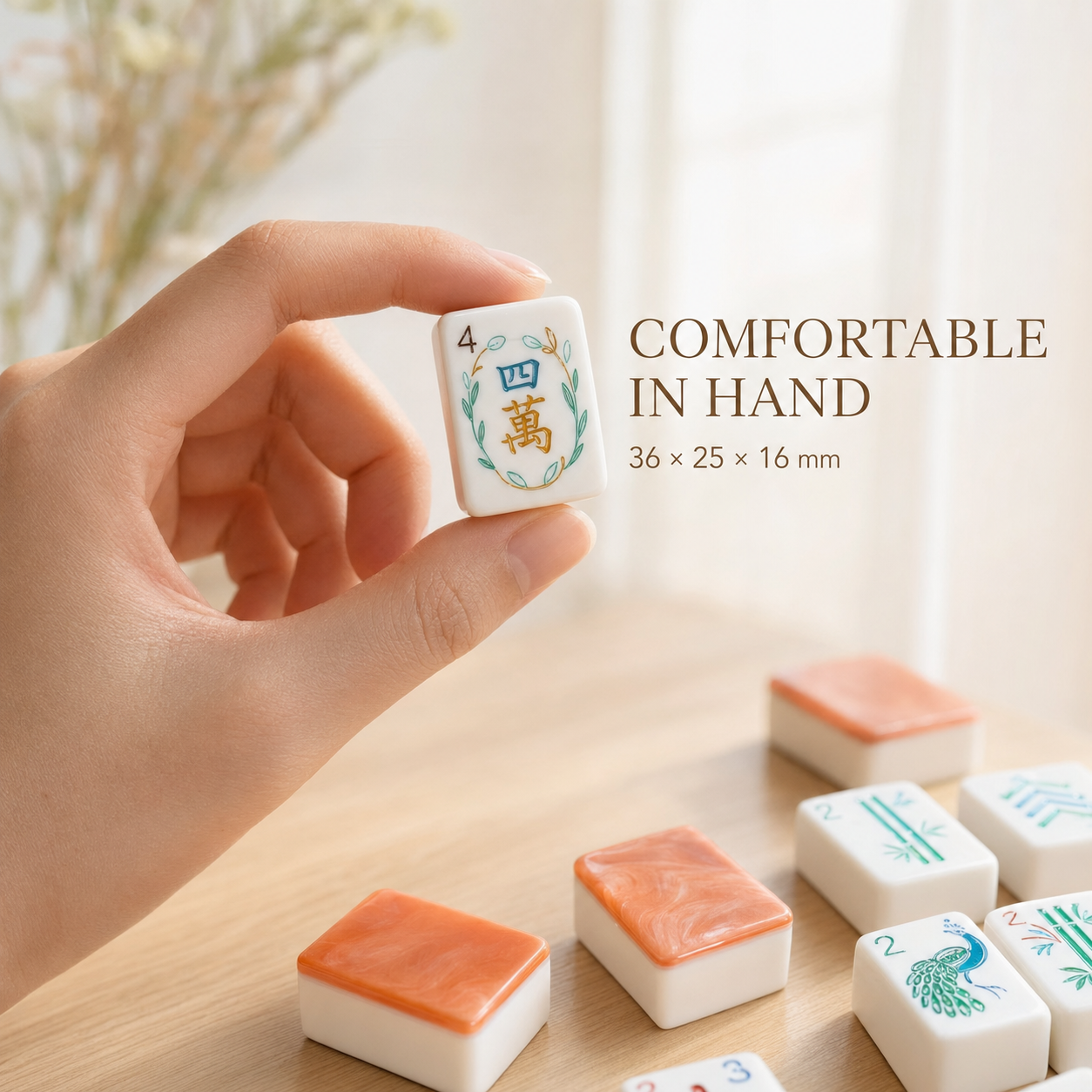 Coral orange American mahjong tile held in hand, measuring 36 by 25 by 16 millimeters