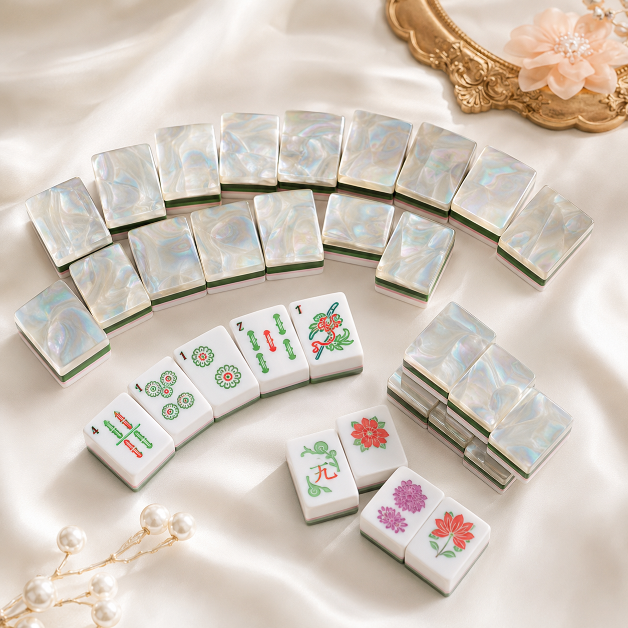 Pearl Garden Mahjong tiles arranged on satin with botanical artwork